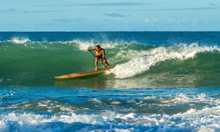 man-paddling-on-paddle-board-with-ocean-waves-1612845